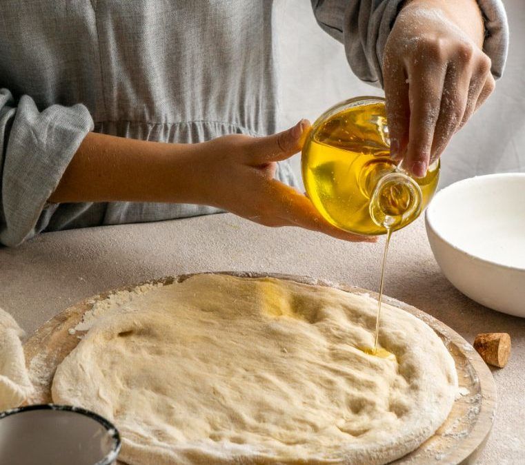 Making homemade pizza dough with EVOO